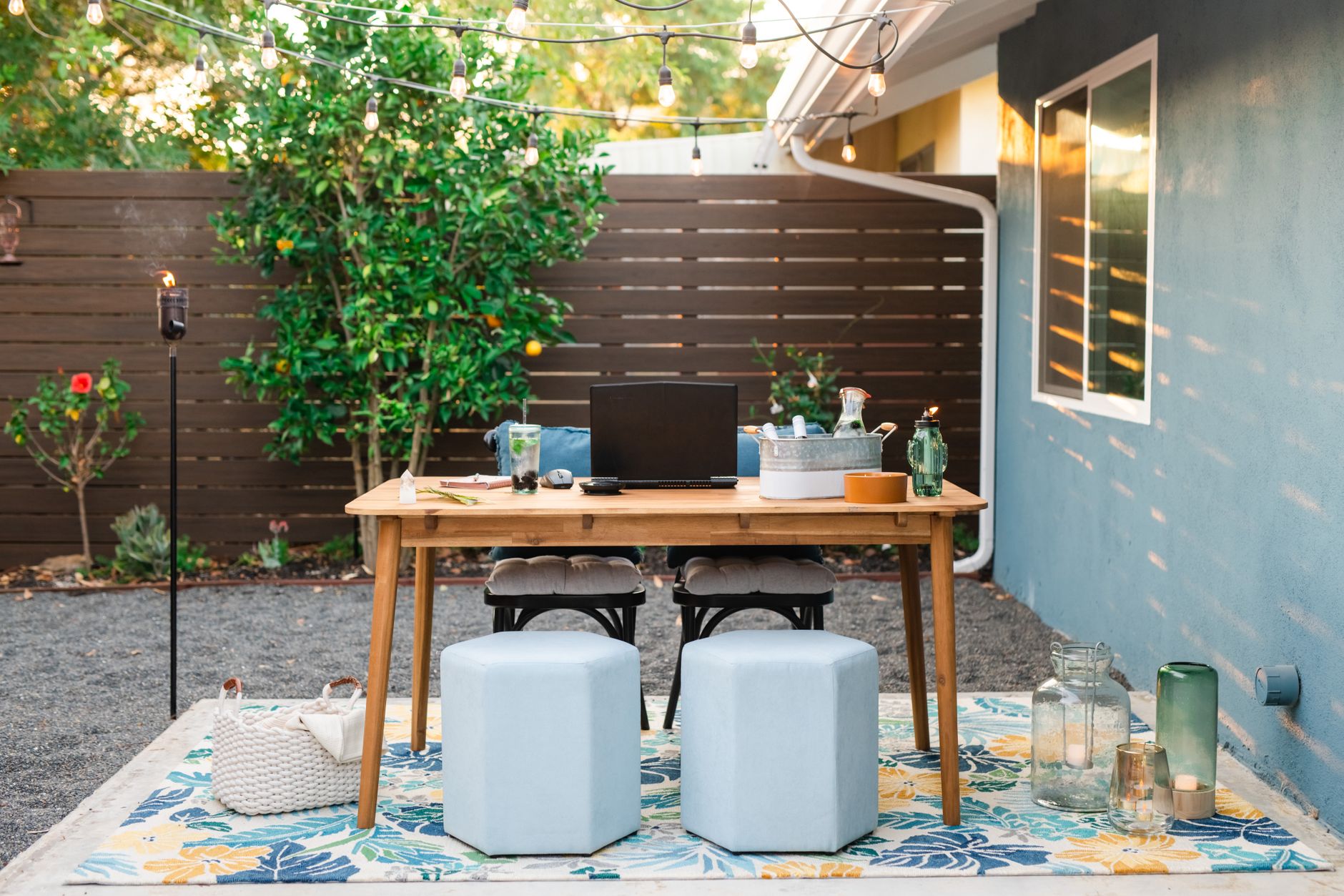 Outdoor garden office workspace with laptop; illustrative photo
