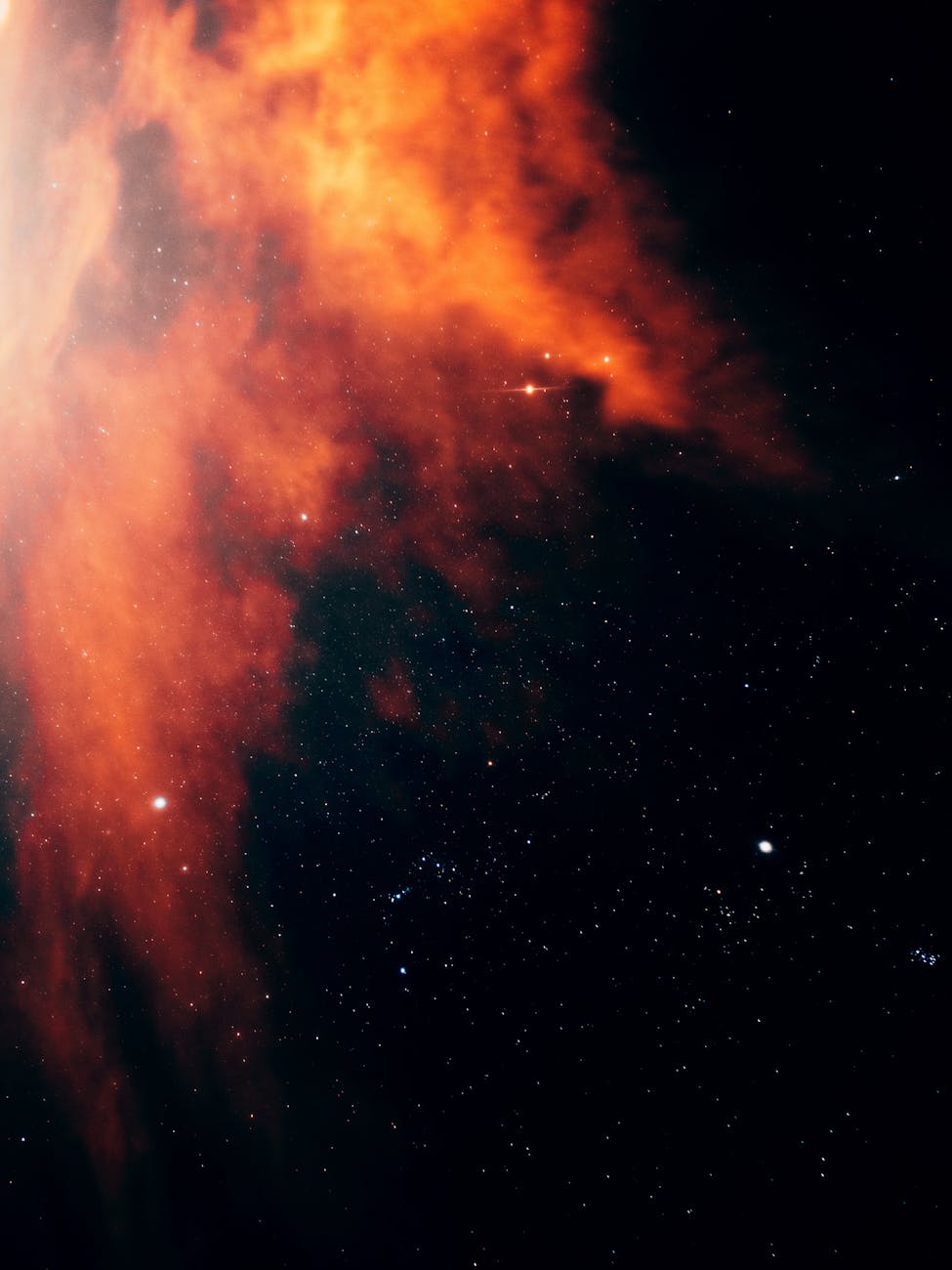 Vibrant nebula captured in deep space, displaying vivid colors against a starry sky.