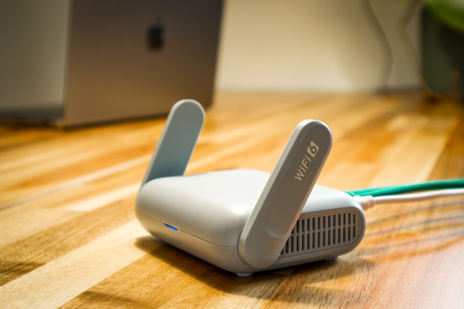 Wireless router and cable representing Starlink hardware and accessories