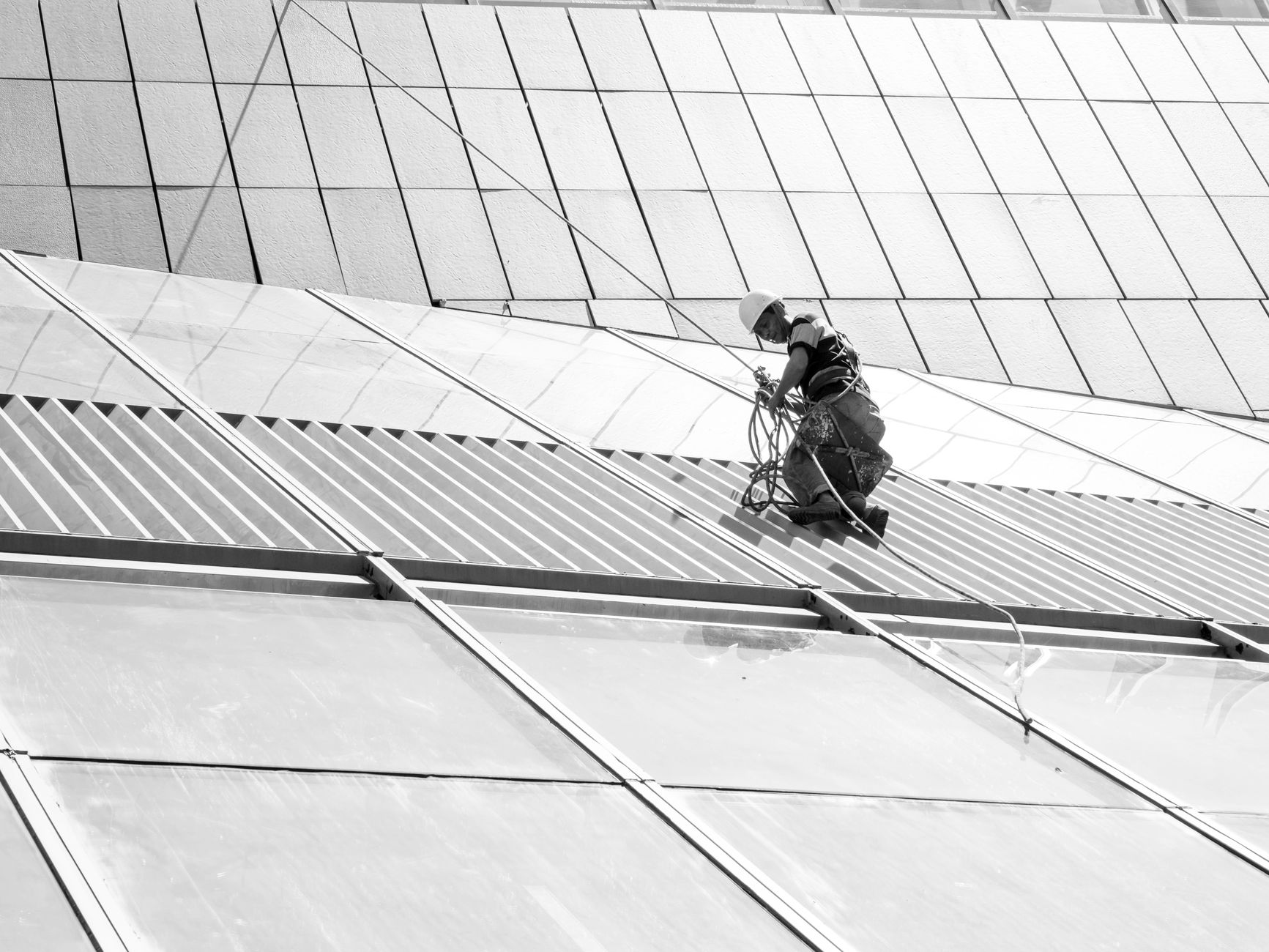 Worker using safety equipment at height