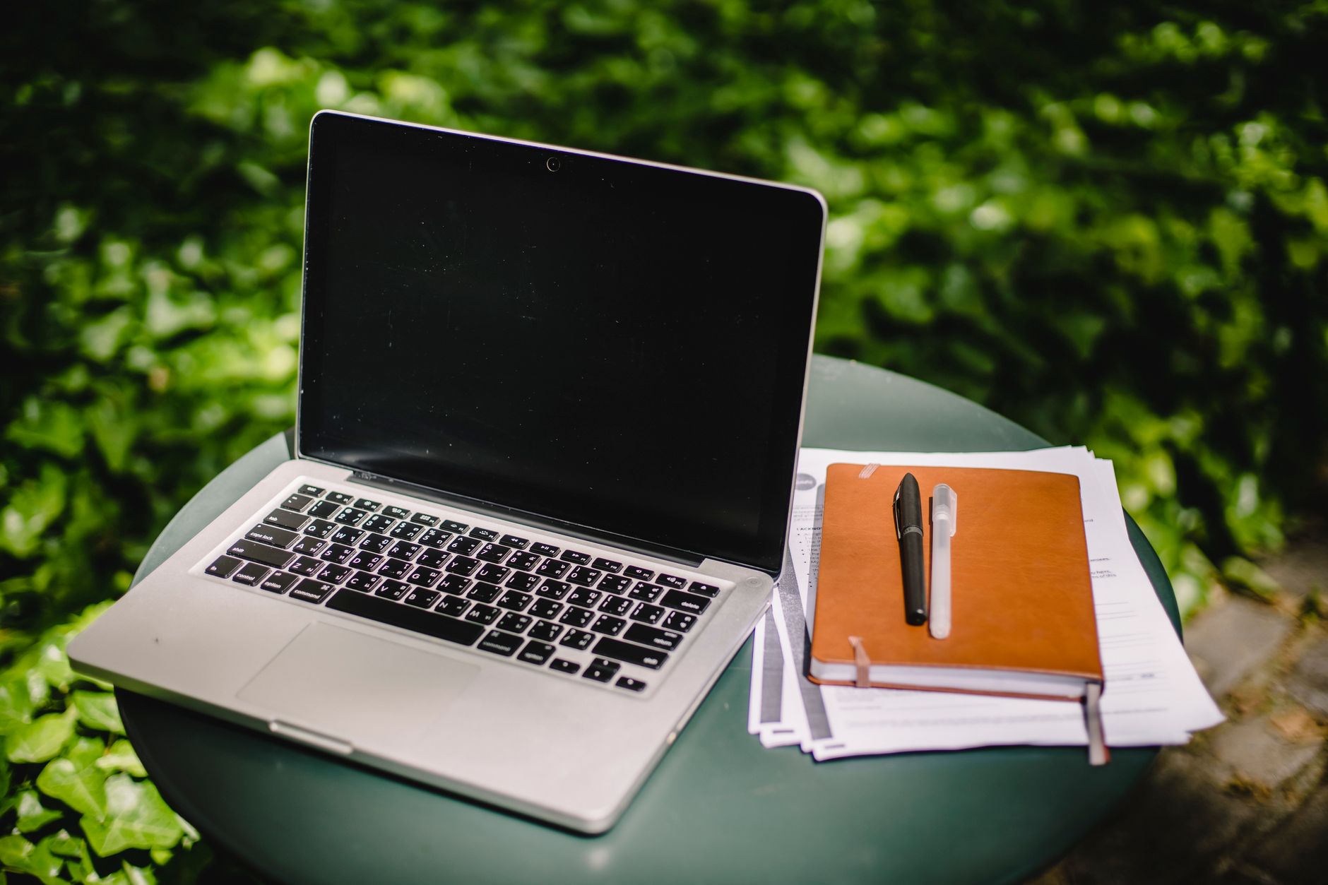 Laptop and notebook outdoors representing practical Starlink tips