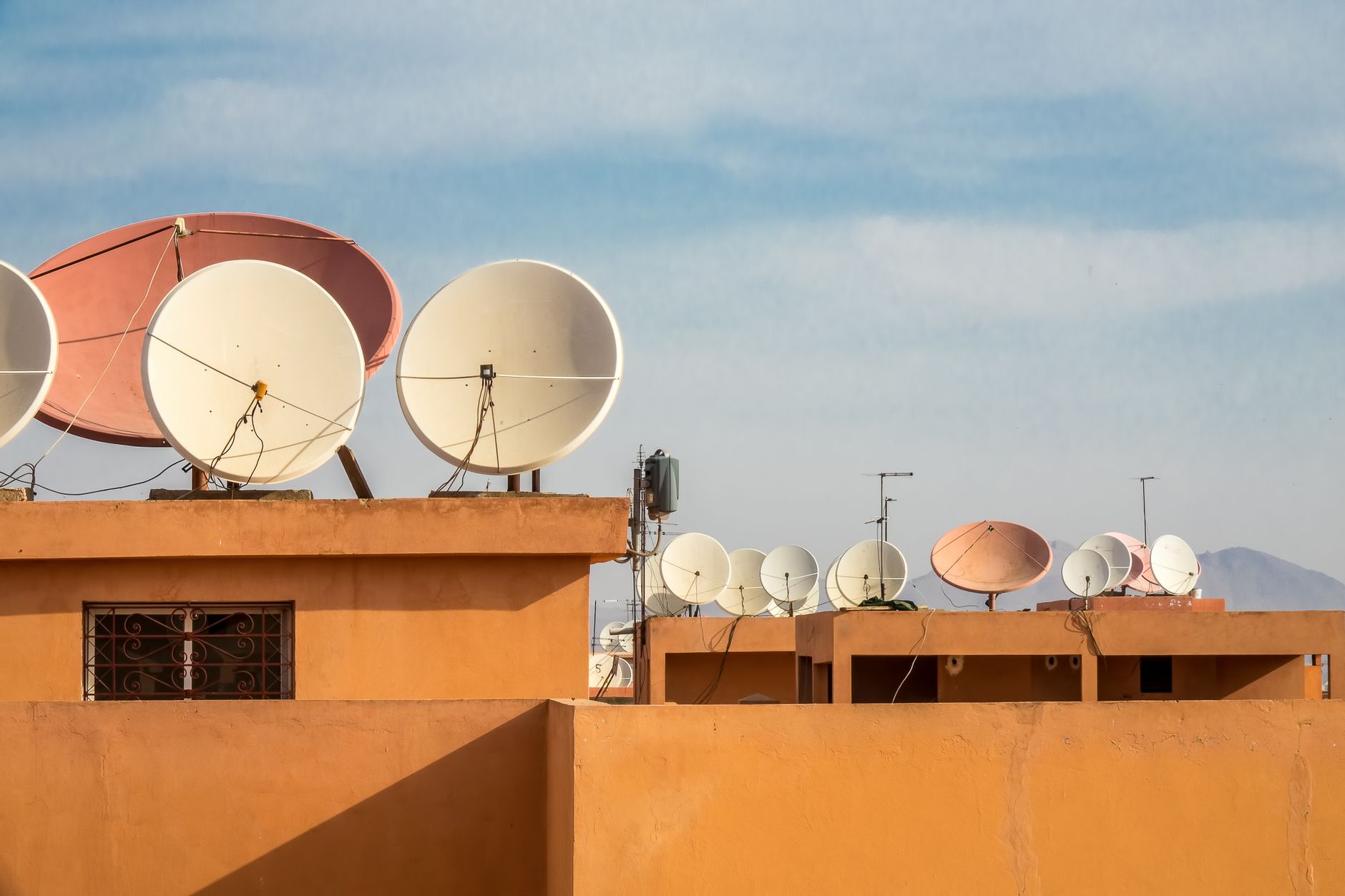 Satellite dishes mounted on rooftops for installation and setup guides
