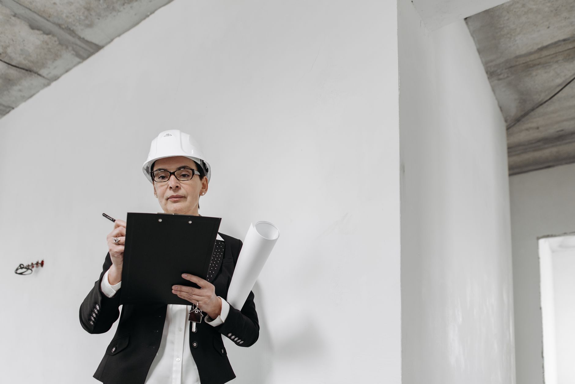 Installer reviewing a building-work checklist