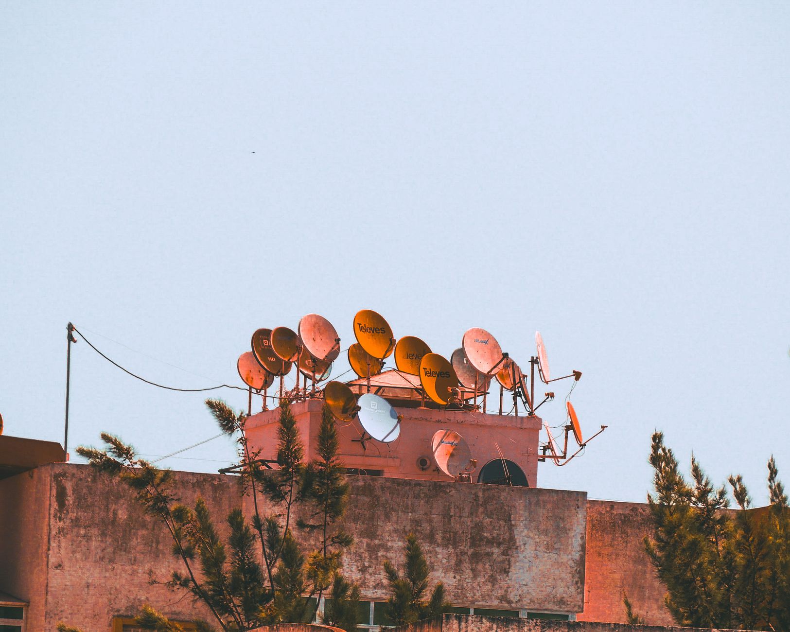 Satellite dishes with open sky illustrating how to avoid Starlink obstructions.