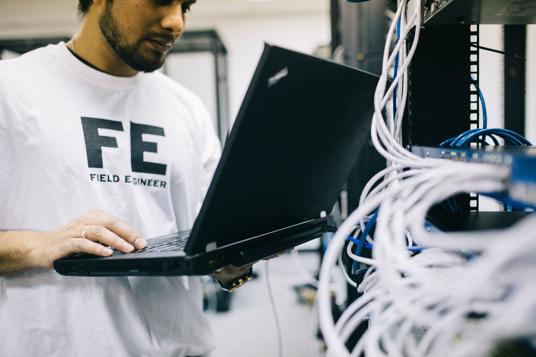 A technician diagnosing network hardware and connection issues for Starlink troubleshooting.