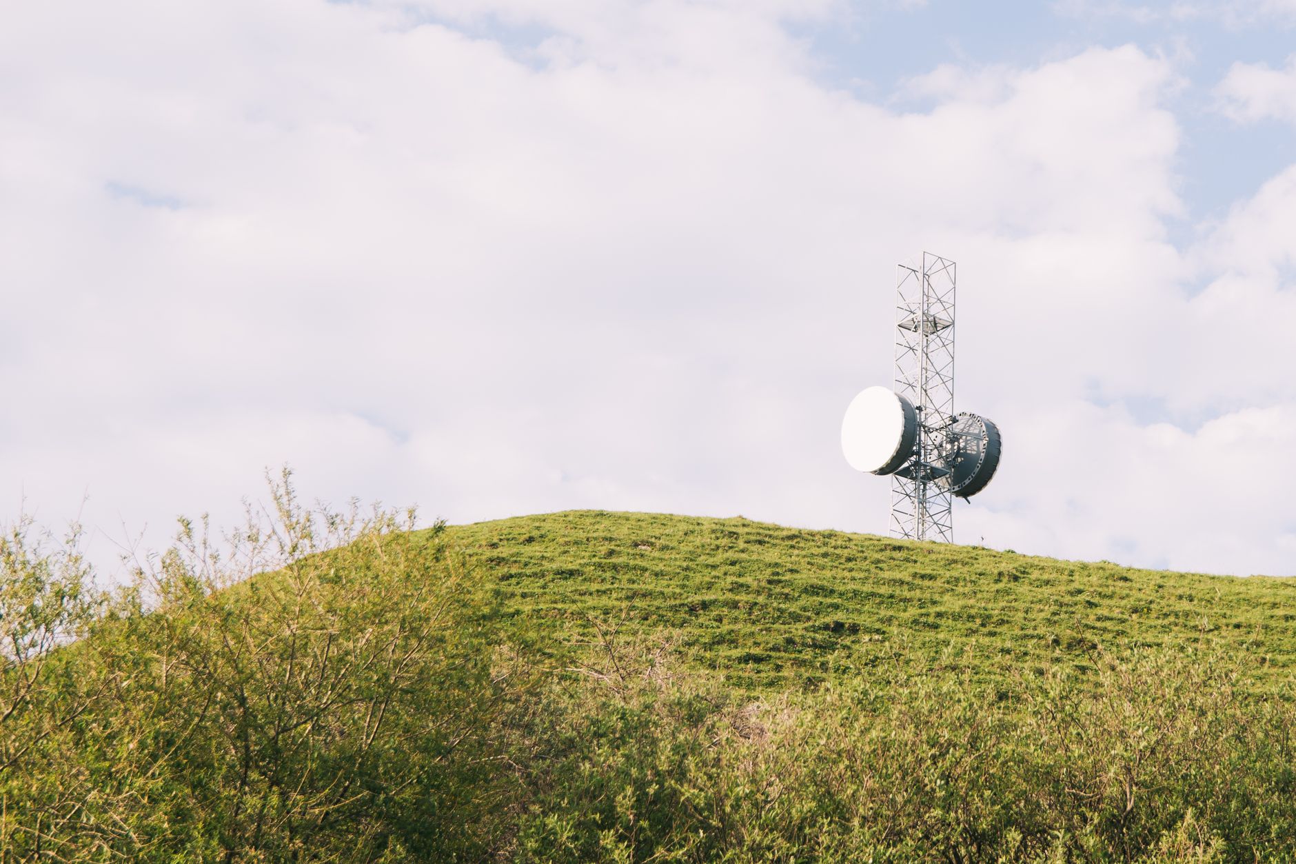 A rural communications installation illustrating Starlink versus traditional satellite internet.